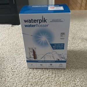 Waterpik water flosser. New in sealed box. Aquarius Professional